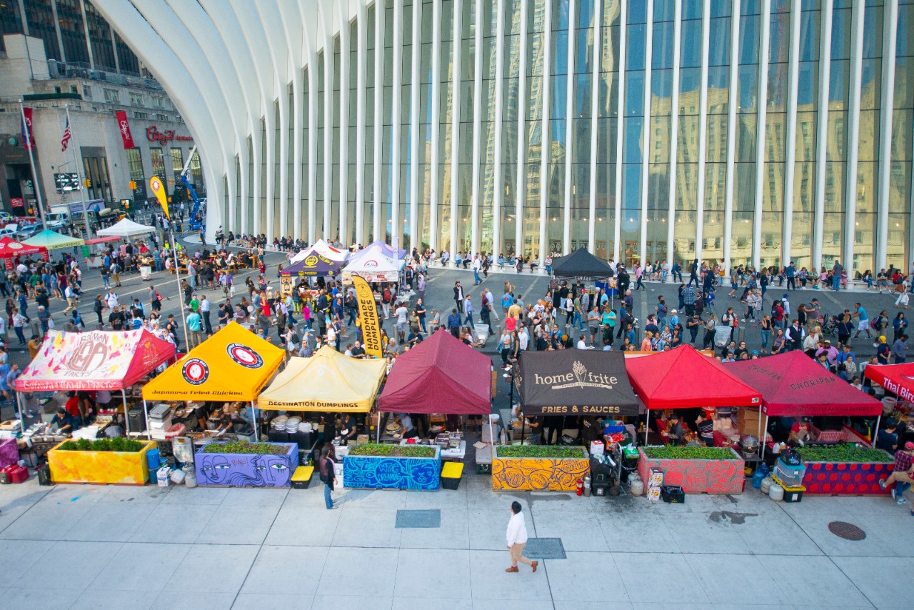 Vendors and visitors gather outside the Oculus for the weekly Smorgasburg food market.